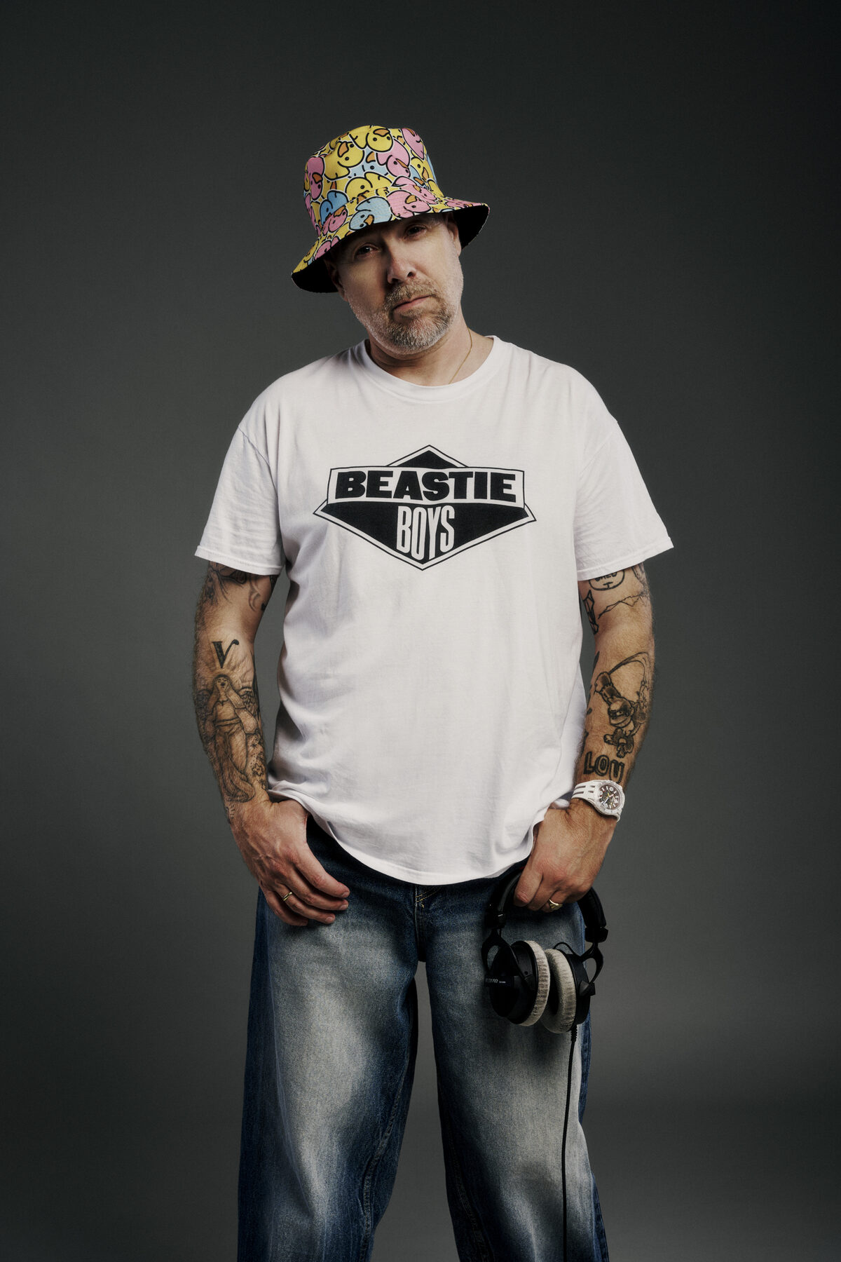 Sebastien Bruce in a white T-shirt and bucket hat