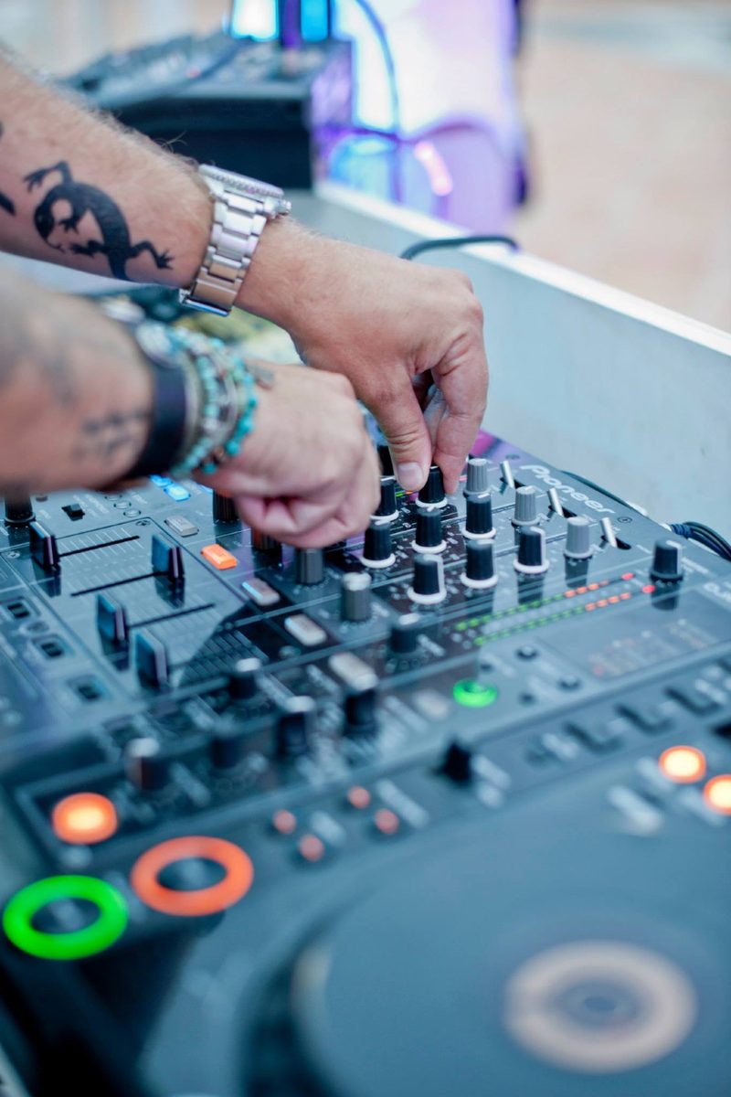 Sebastien Bruce hands on a DJ mixer