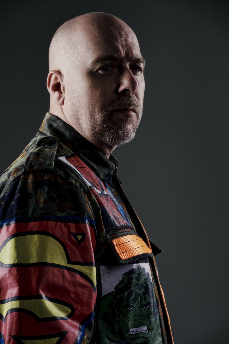 Sebastien Bruce in a camouflage jacket with superhero patches